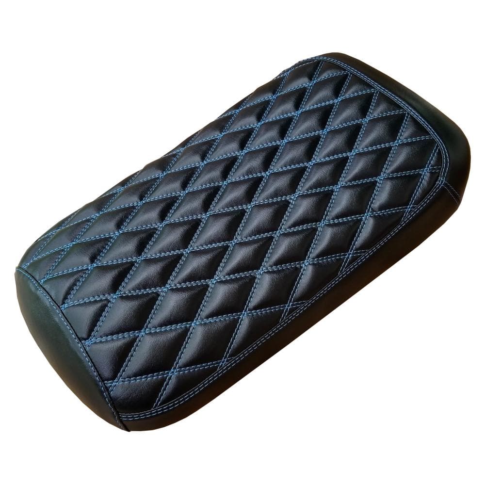 Black diamond-stitched Maddog seat cover with blue contrast stitching against a black background, overhead view, handmade by Cheeky Seats