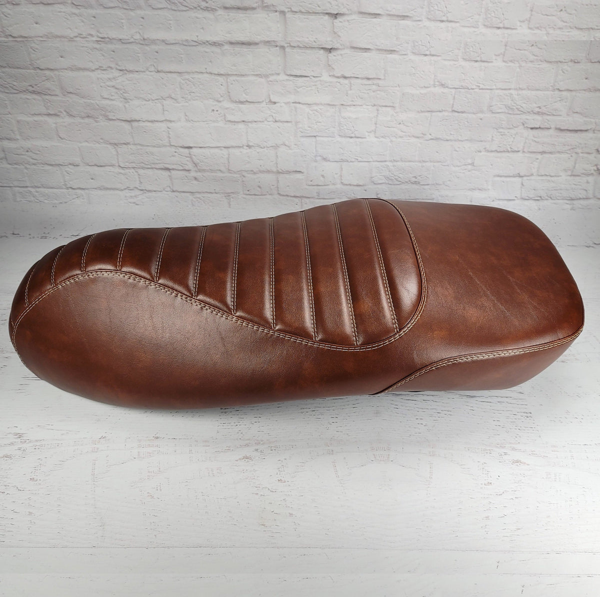 Vespa GTS whiskey tuck and roll seat cover, side view