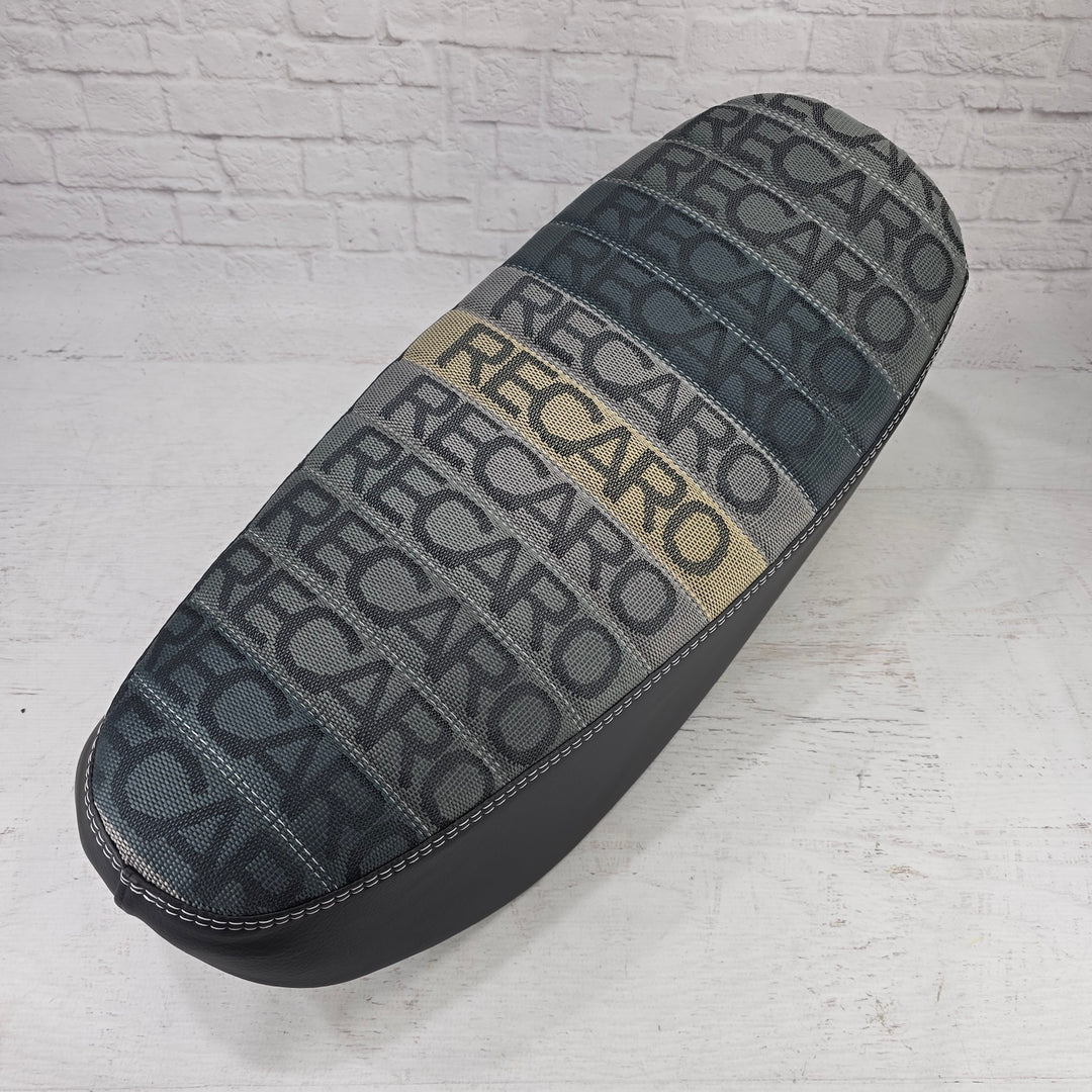 Gray and black RECARO patterned Honda DAX 125 tuck-and-roll seat cover with tonal stitching, handmade by Cheeky Seats