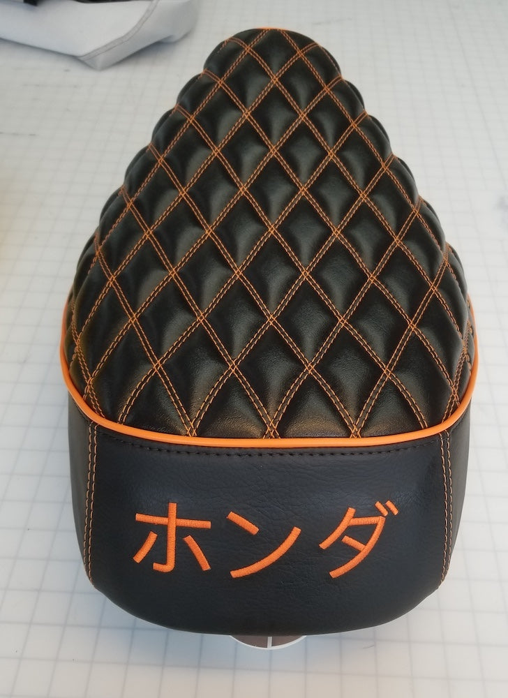 Honda Elite SA50 Double Diamond Seat Cover, with orange stitching, piping and Honda logo, handmade Honda Elite SA50 seat cover by Cheeky Seats, 