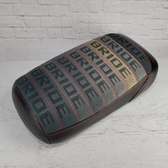 Maddog Gradient Bride fabric seat cover fading from dark gray to tan and cream with repeating BRIDE text, red stitching, and black side panels, handmade by Cheeky Seats