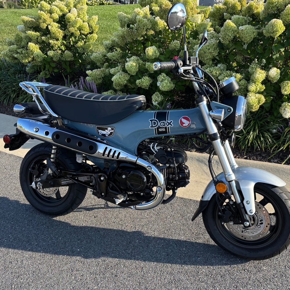 Pearl Gray-Honda DAX 125 with a black tuck-and-roll seat, with matching piping, handmade by Cheeky Seats
