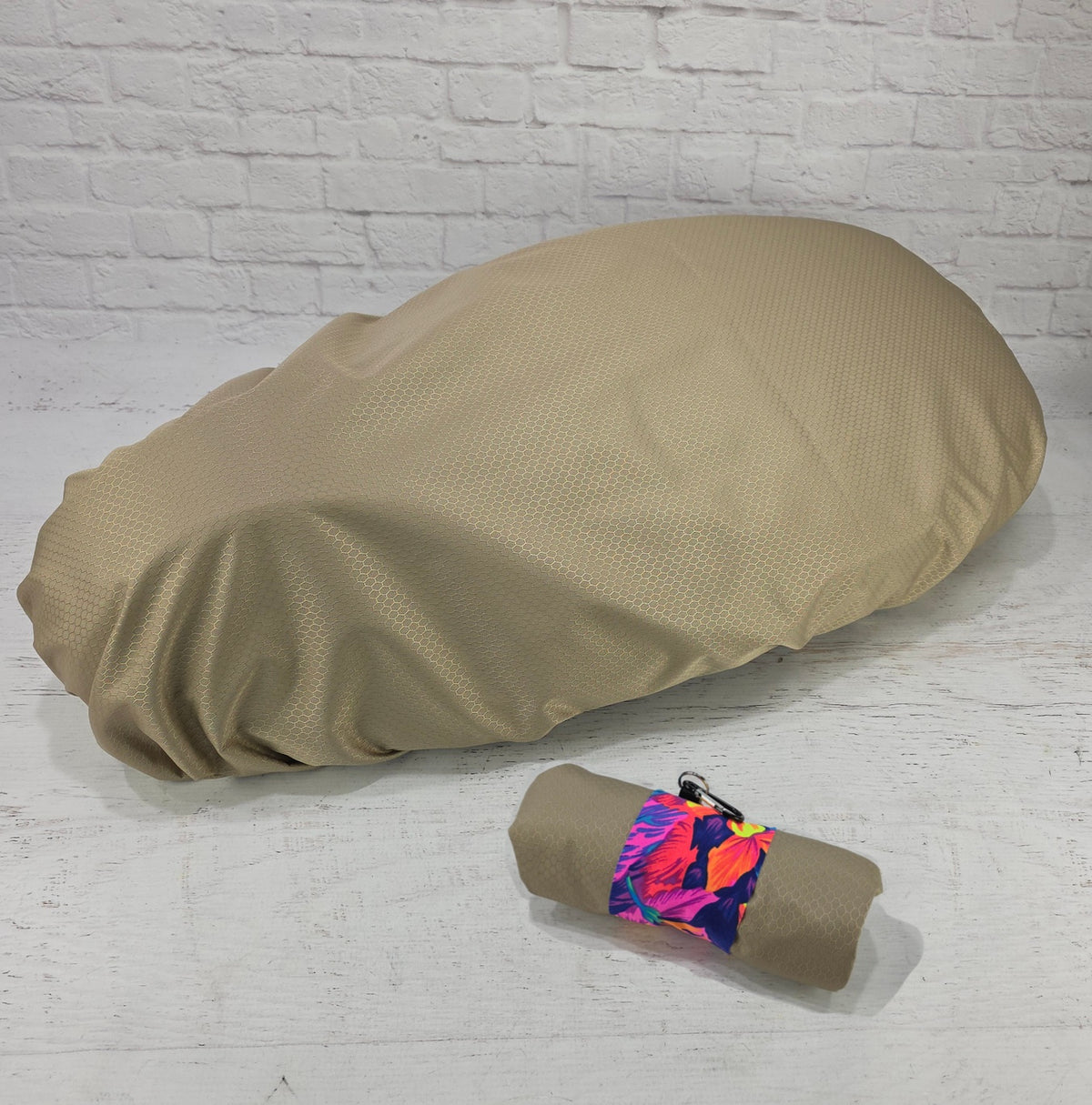 Tan honeycomb rain and elements cover for Piaggio Fly and Liberty seats with matching floral carry pouch, by Cheeky Seats