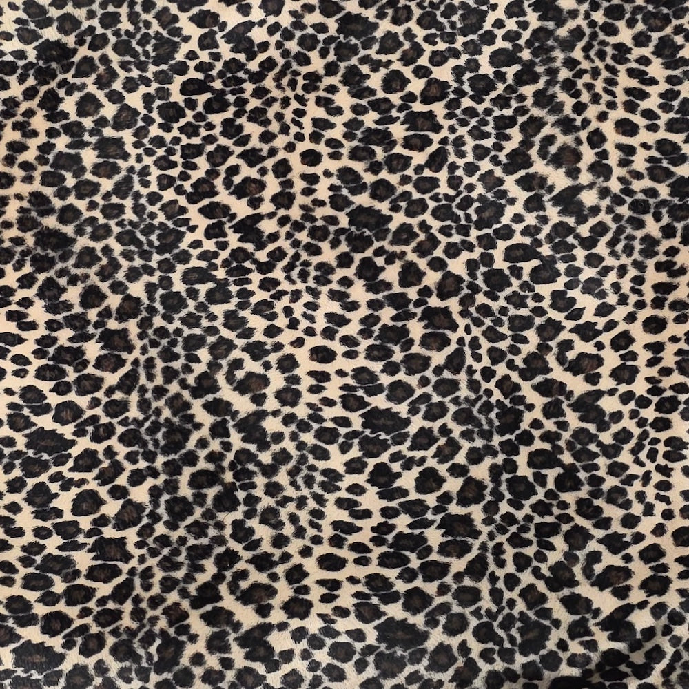 Cream, brown and black cheetah faux-fur swatch for a Cheeky Seats Genuine Buddy cover option