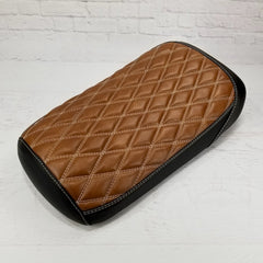 Tan caramel diamond-stitched top with black side panels and white contrast stitching on the Maddog seat cover, handmade by Cheeky Seats