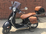 Vespa GTS distressed caramel seat cover on scooter