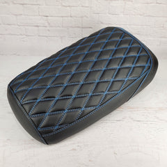 Matte black diamond-stitched Maddog seat cover with blue contrast stitching, handmade by Cheeky Seats