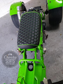 Customer photo of a lime green Maddog Trike from above showing the black hexagon honeycomb seat cover with green stitching and green piping, handmade by Cheeky Seats