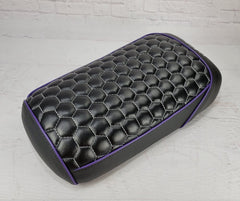Black Maddog 50 / 150 hexagon honeycomb seat cover with purple piping and silver-gray stitching, showing the distinctive hex pattern, handmade by Cheeky Seats