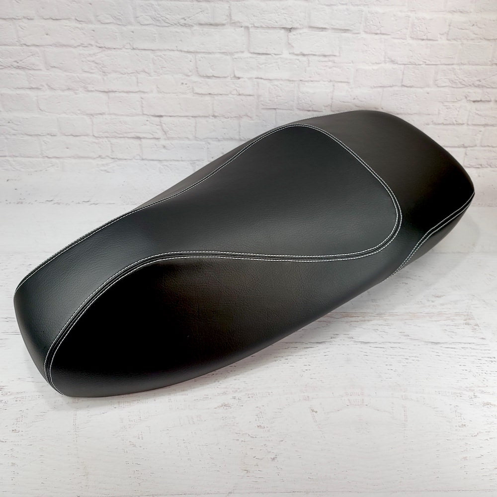 Vespa GTS premium matte black seat cover with French seams, side view