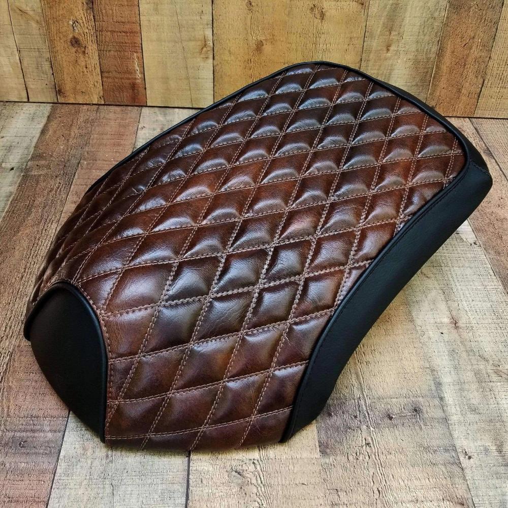 Angled studio view of the Espresso Brown diamond seat cover for Yamaha C3, XF50, Vox and Giggle, handmade by Cheeky Seats.